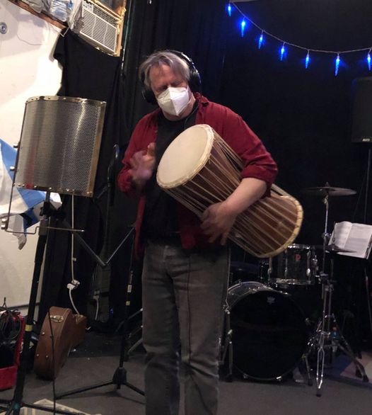 Alan Lake talking a drum.