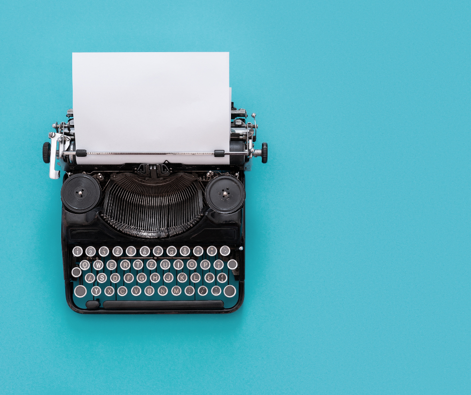 Retro black typewriter with blue background and a piece of paper.