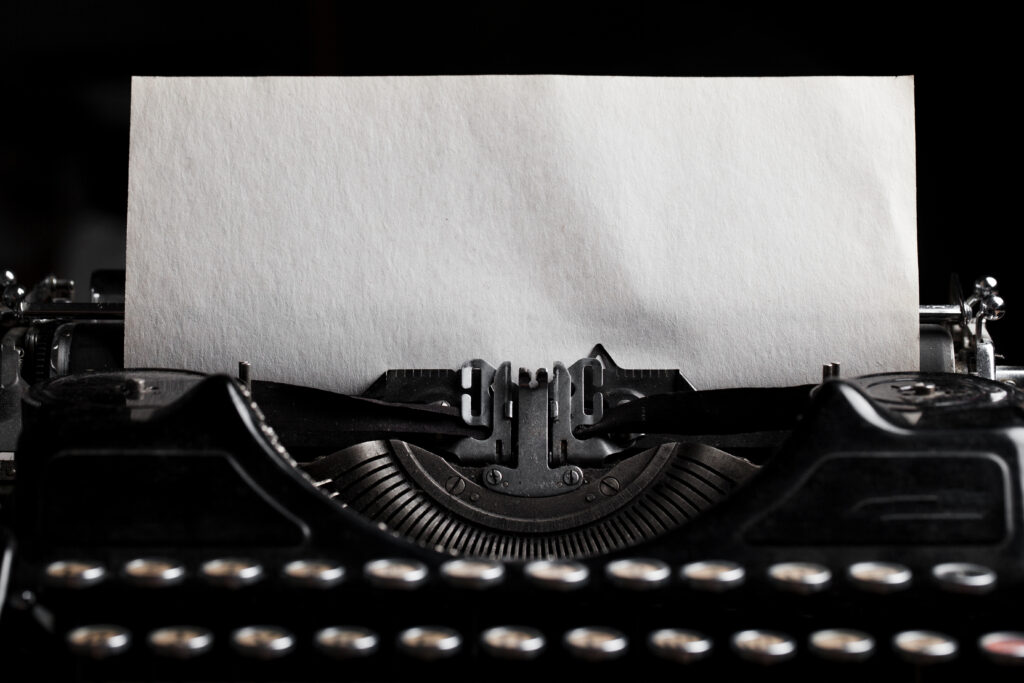 typewriter with paper sheet. 