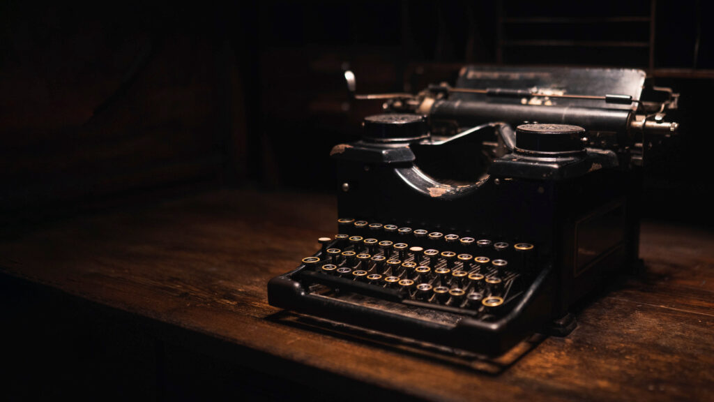 Old typewriter on a wooden table