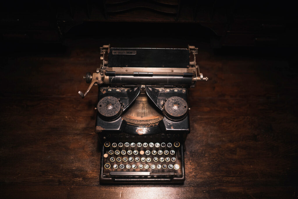 Old typewriter on a wooden table