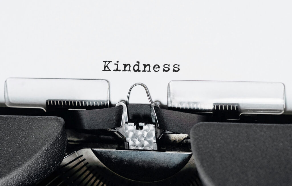 Text kindness typed on retro typewriter