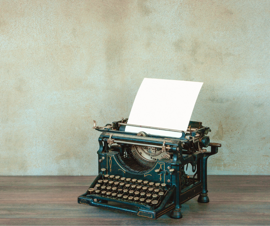 antique black typewriter with paper